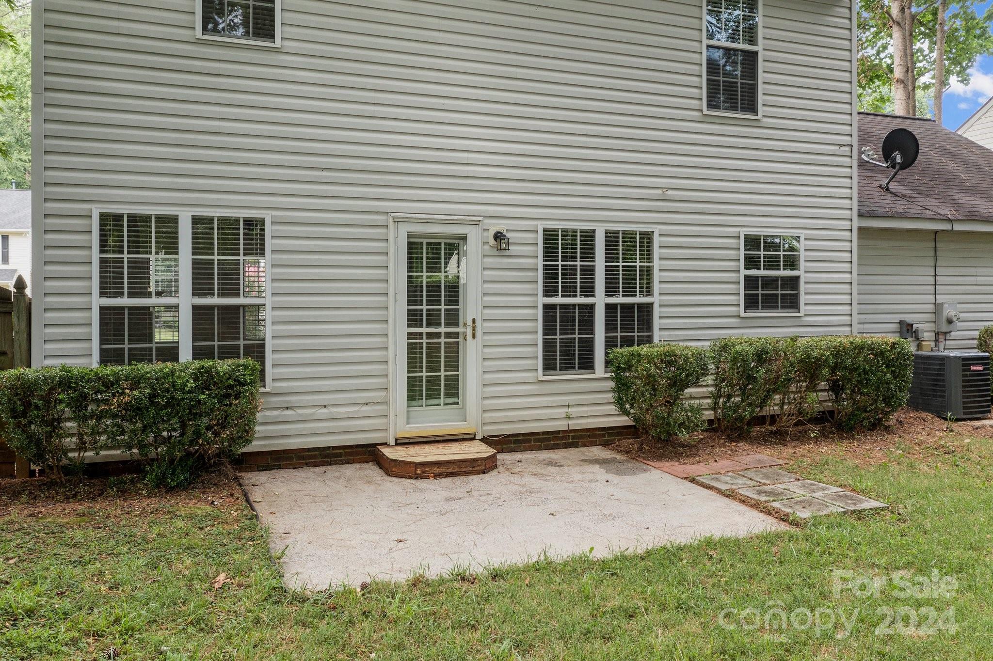 8424 Conner Ridge Lane Charlotte, NC 28269 - Photo 37 of 48 a view of a house with backyard and plants