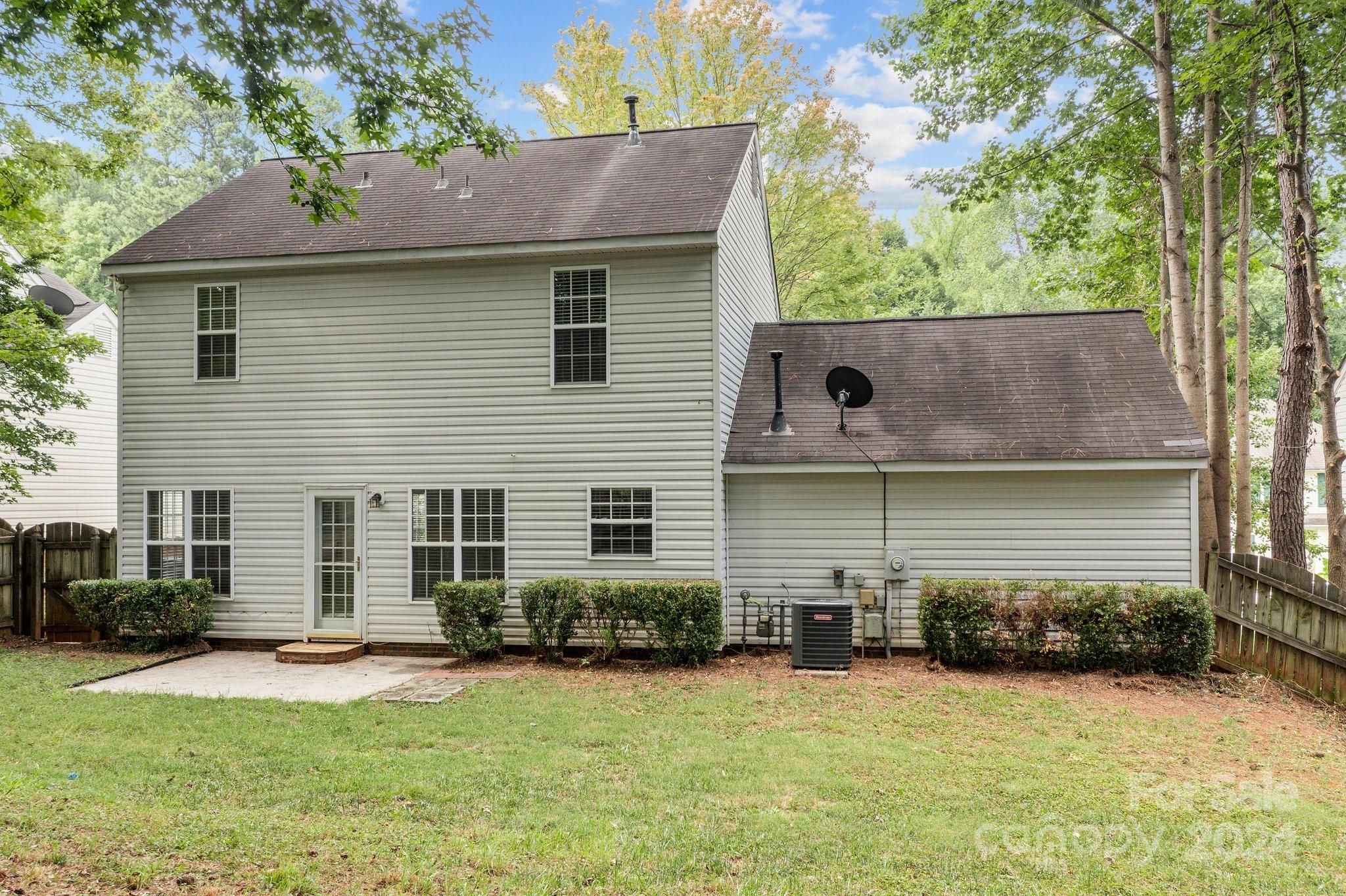 8424 Conner Ridge Lane Charlotte, NC 28269 - Photo 41 of 48 a view of a house with a yard