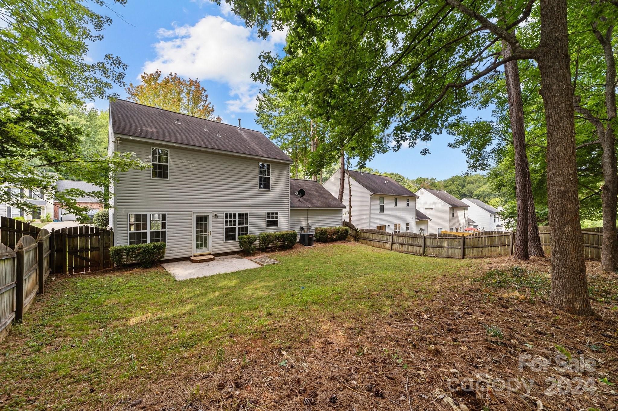 8424 Conner Ridge Lane Charlotte, NC 28269 - Photo 42 of 48 a view of a house with a yard