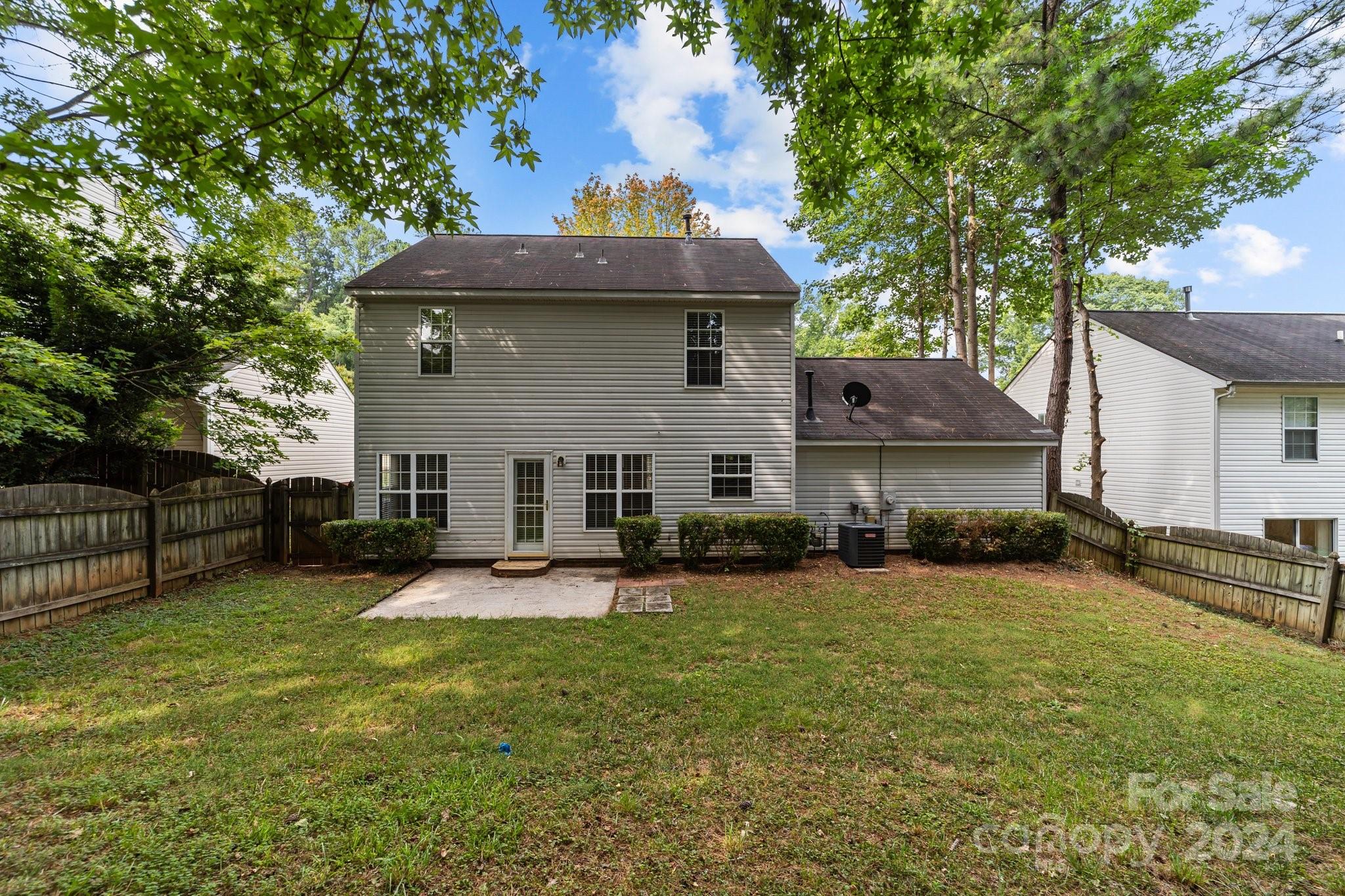 8424 Conner Ridge Lane Charlotte, NC 28269 - Photo 43 of 48 a view of a house with a yard