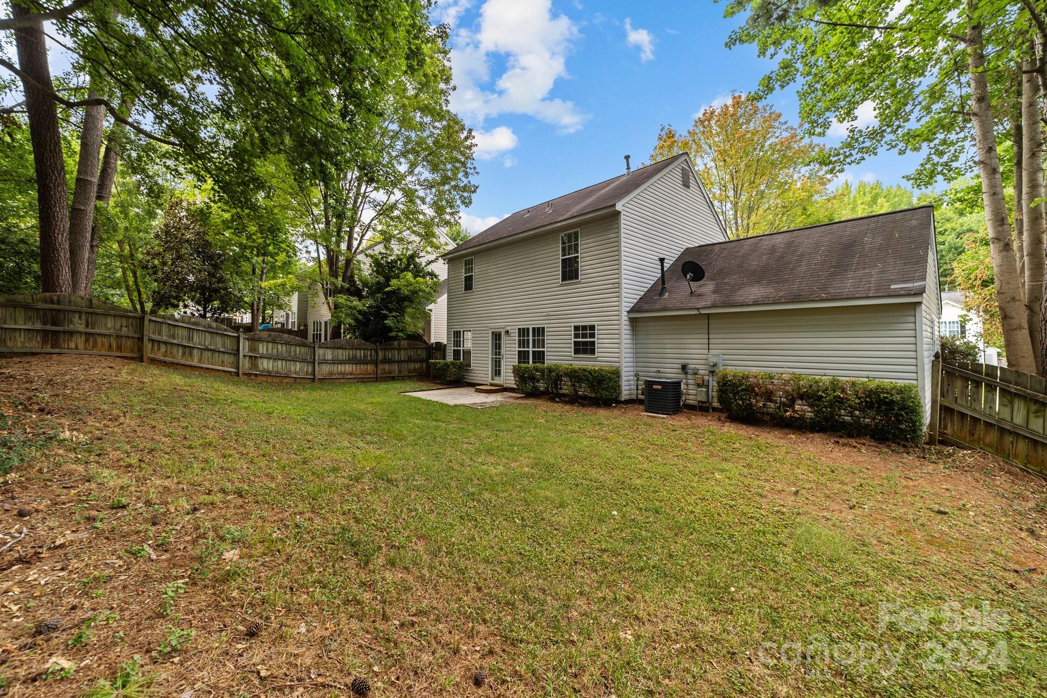 8424 Conner Ridge Lane Charlotte, NC 28269 - Photo 44 of 48 a view of a house with a yard