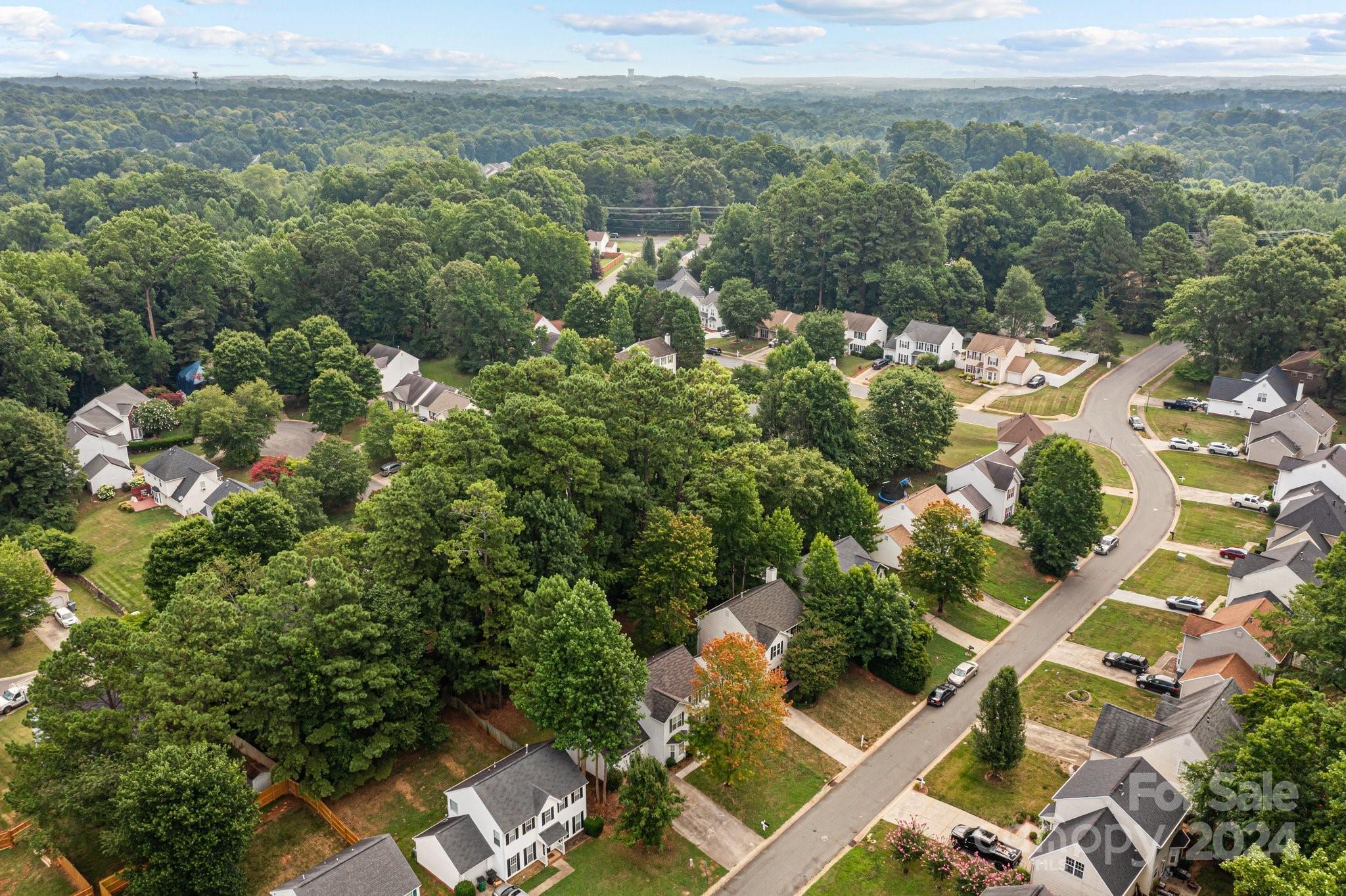 8424 Conner Ridge Lane Charlotte, NC 28269 - Photo 48 of 48 an aerial view of a house with a yard