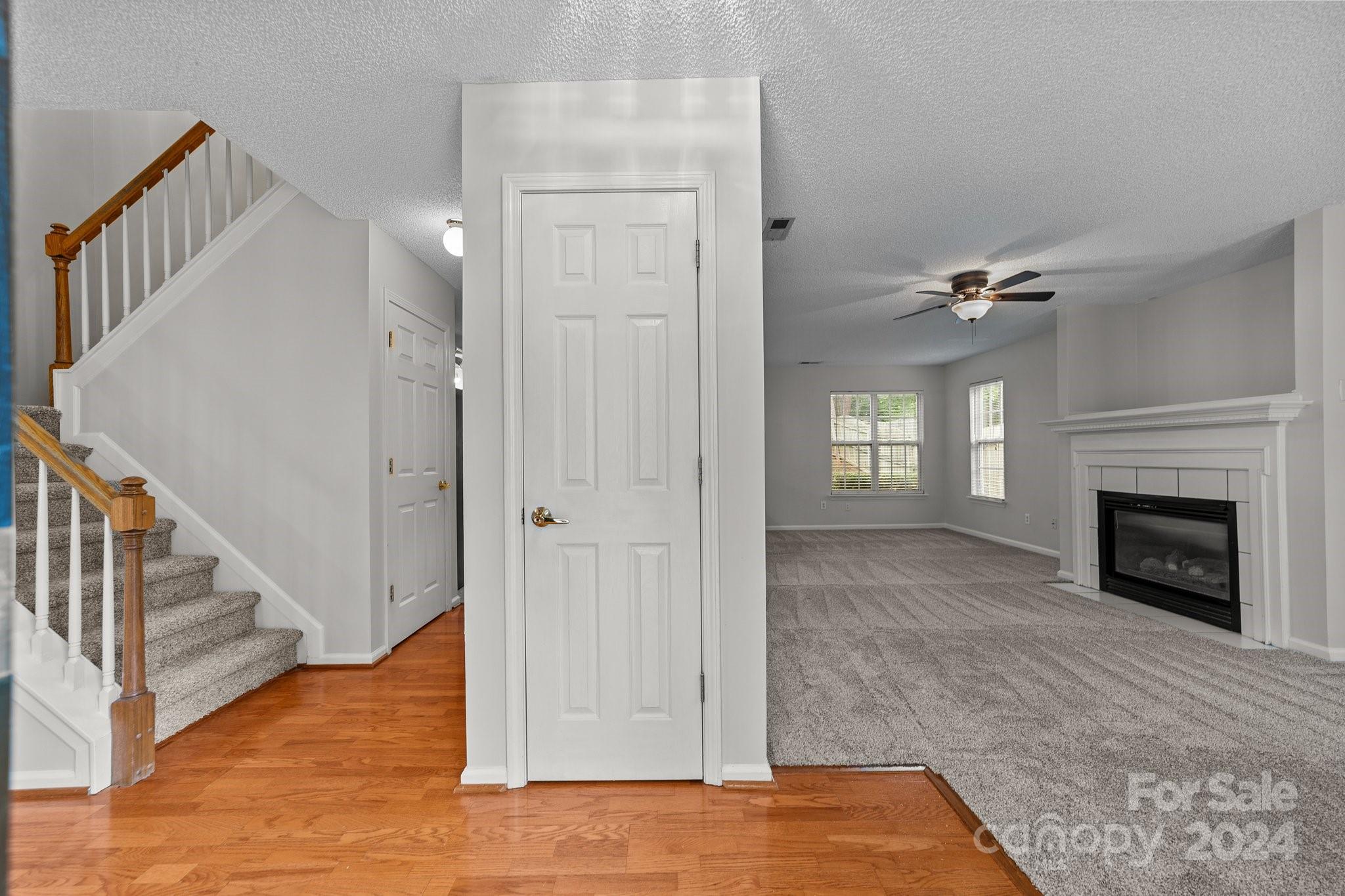 8424 Conner Ridge Lane Charlotte, NC 28269 - Photo 5 of 48 a view of a livingroom with wooden floor and a fireplace