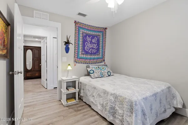 a bedroom with a bed and a table