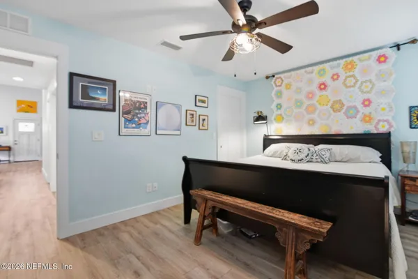 a view of room with furniture and wooden floor