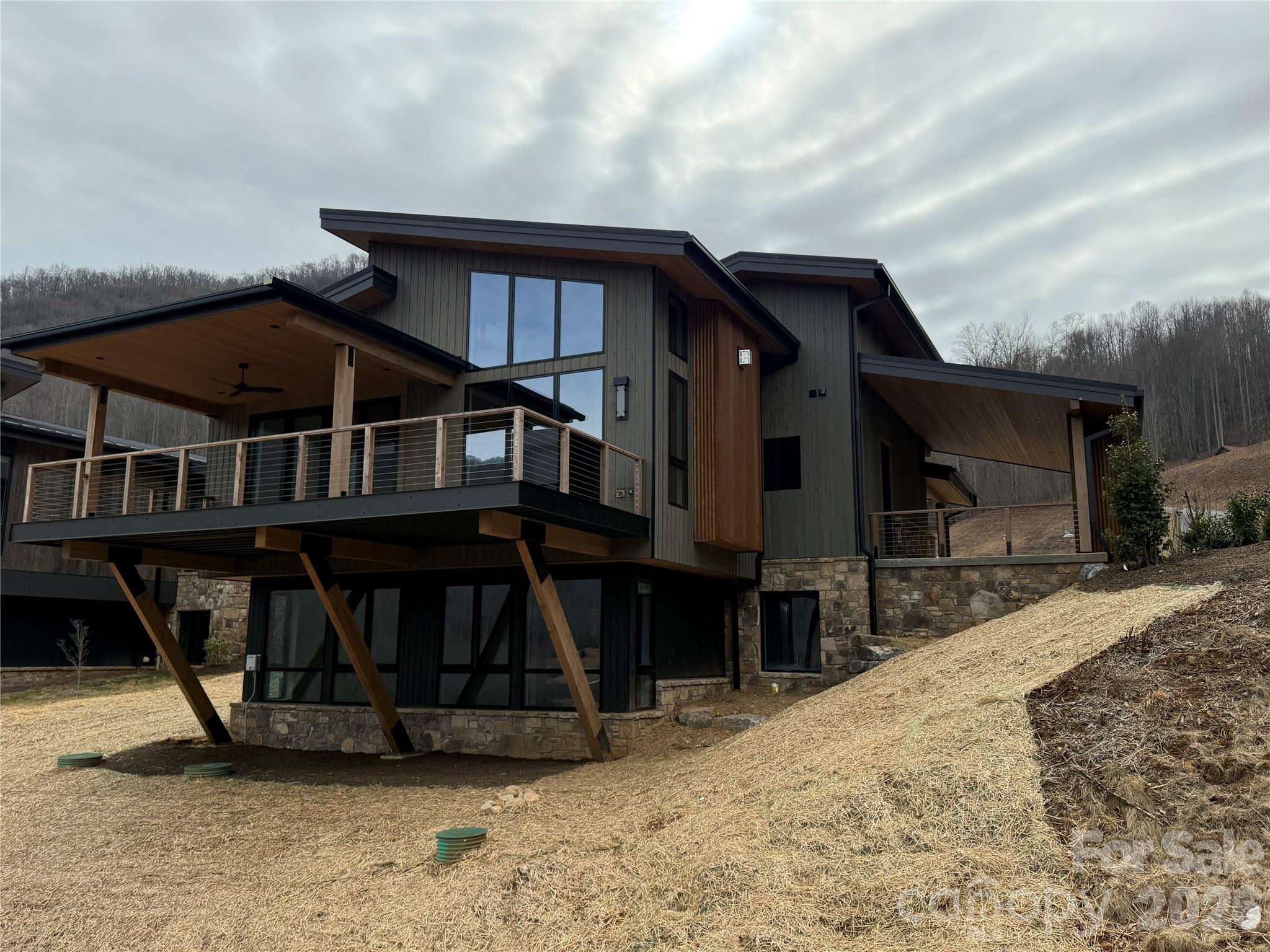 7 Switchgrass Way Sylva, NC 28779 - Photo 2 of 2 a front view of a house with a balcony