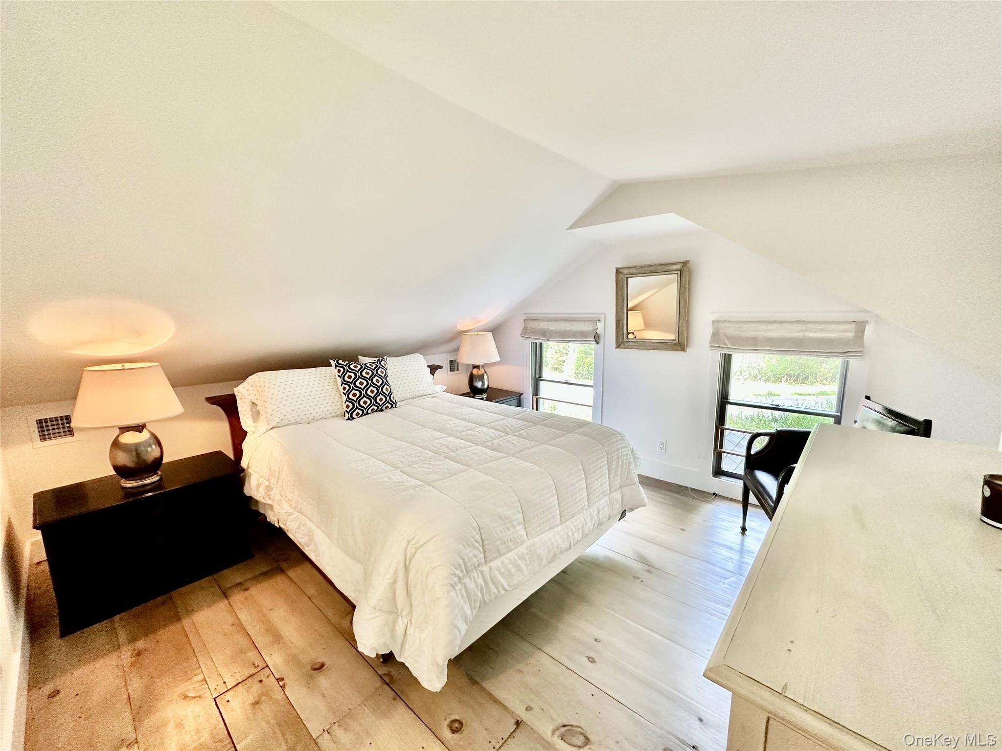 1350 Brick Kiln Road Sag Harbor, NY 11963 - Photo 14 of 21 a bedroom with a bed and window