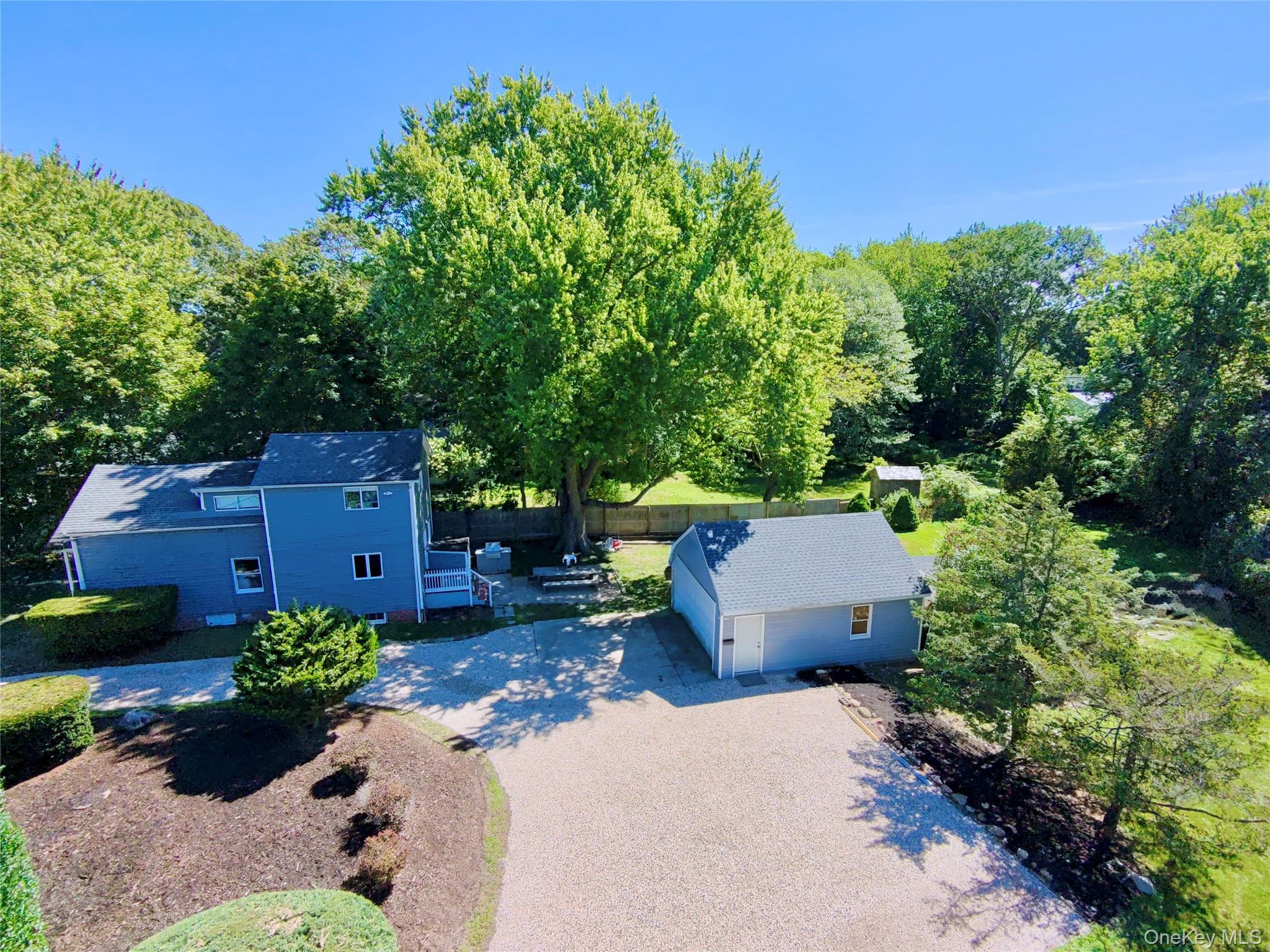 1350 Brick Kiln Road Sag Harbor, NY 11963 - Photo 18 of 21 an aerial view of a house with a yard and outdoor seating