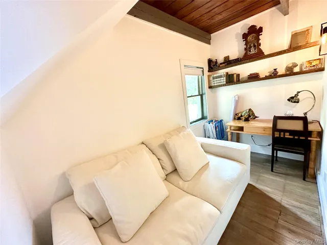 a outdoor living room with furniture and a rug
