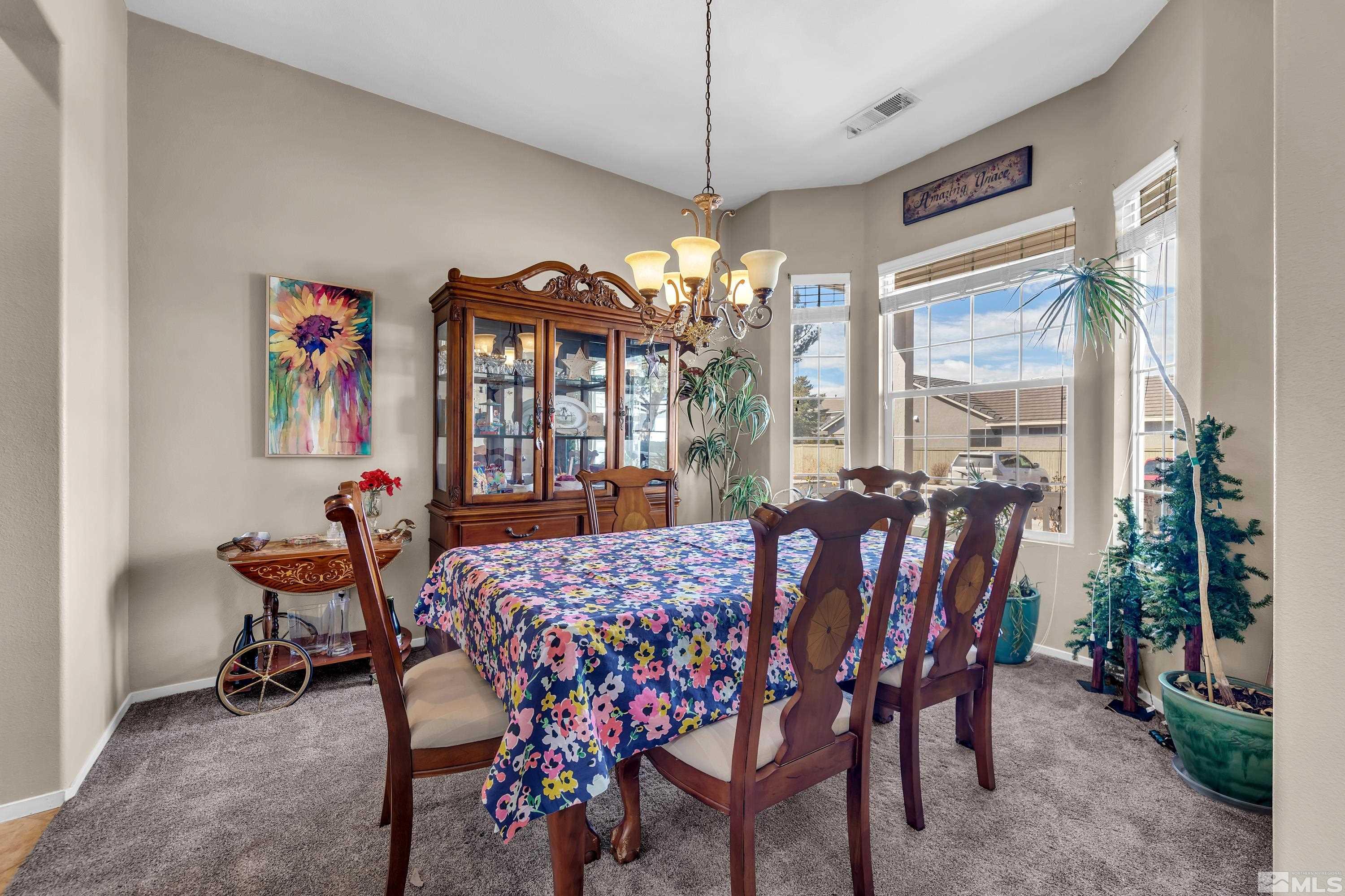 1496 Gaucho Lane Reno, NV 89521 - Photo 13 of 40 a view of a dining room with furniture window and outside view