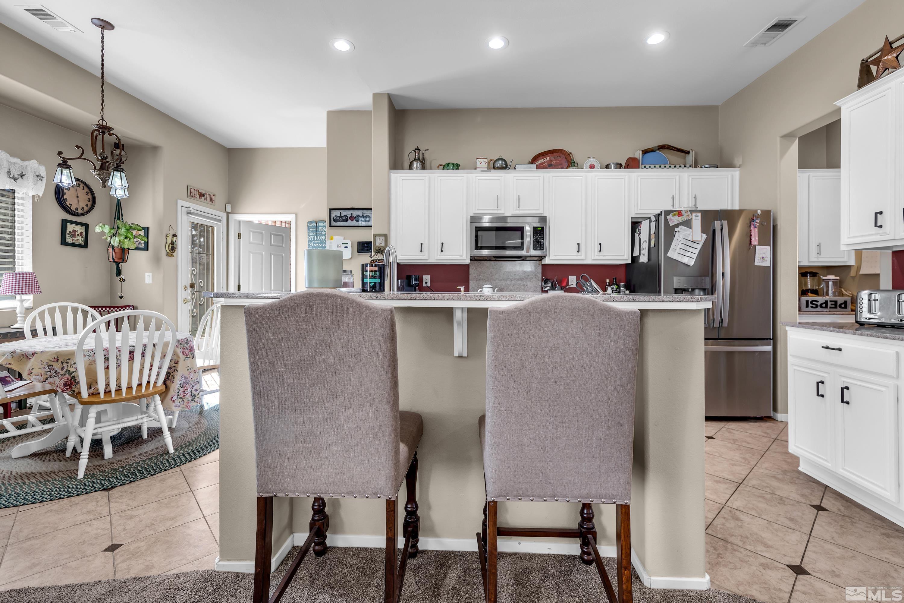 1496 Gaucho Lane Reno, NV 89521 - Photo 16 of 40 a view of kitchen with furniture and wooden floor