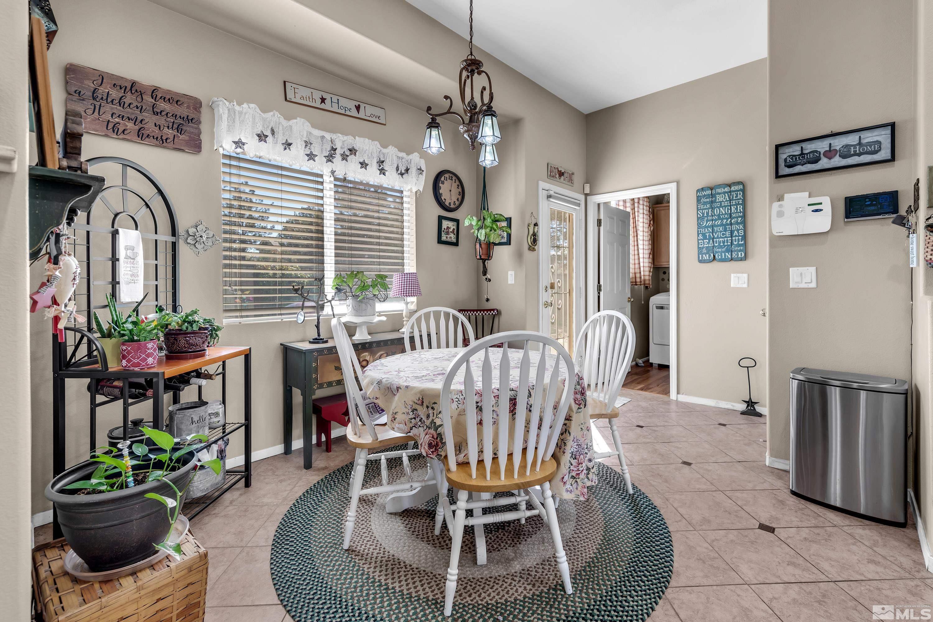 1496 Gaucho Lane Reno, NV 89521 - Photo 20 of 40 a dining room with furniture and window