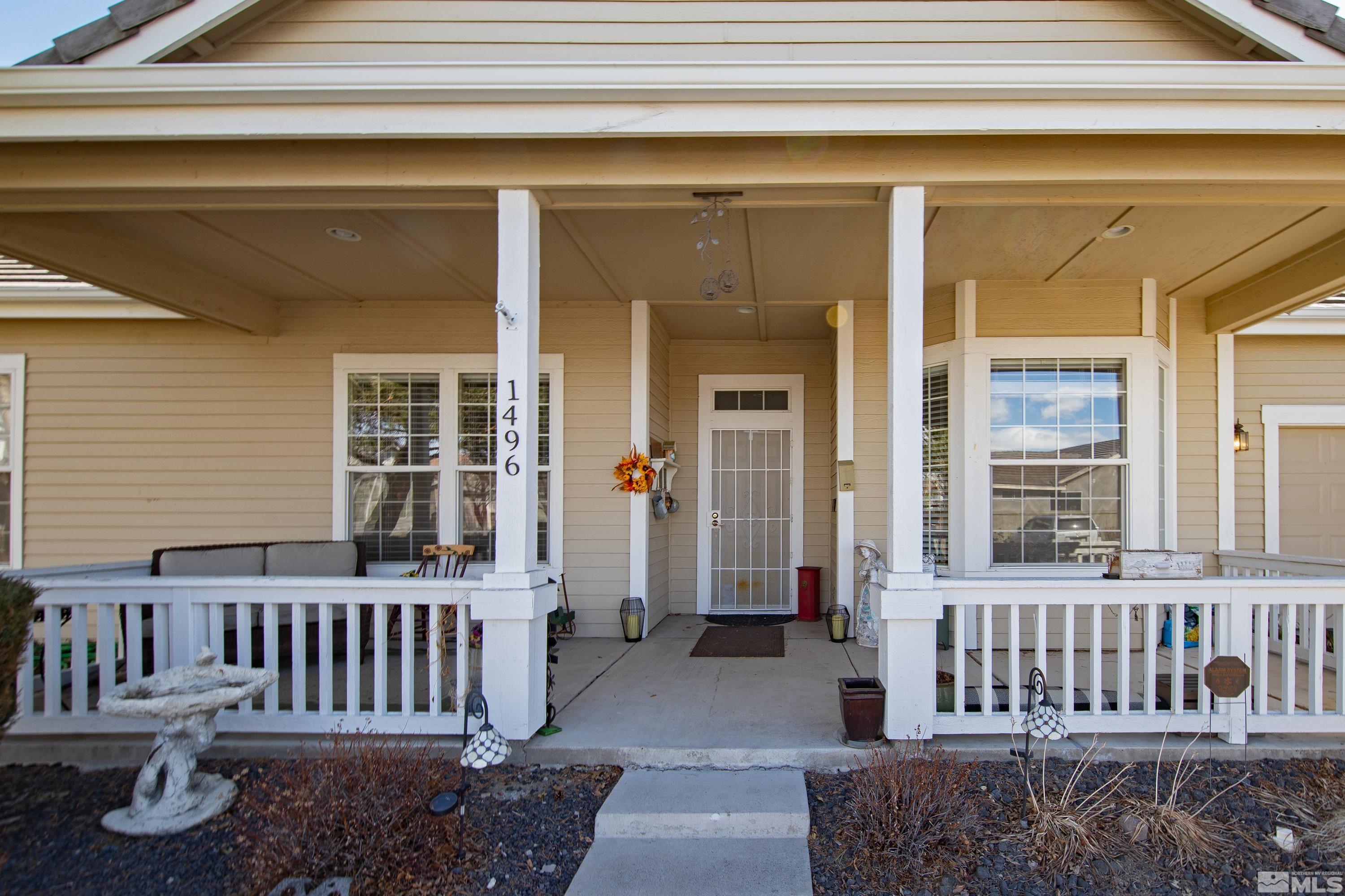 1496 Gaucho Lane Reno, NV 89521 - Photo 2 of 40 a view of a porch with a bench