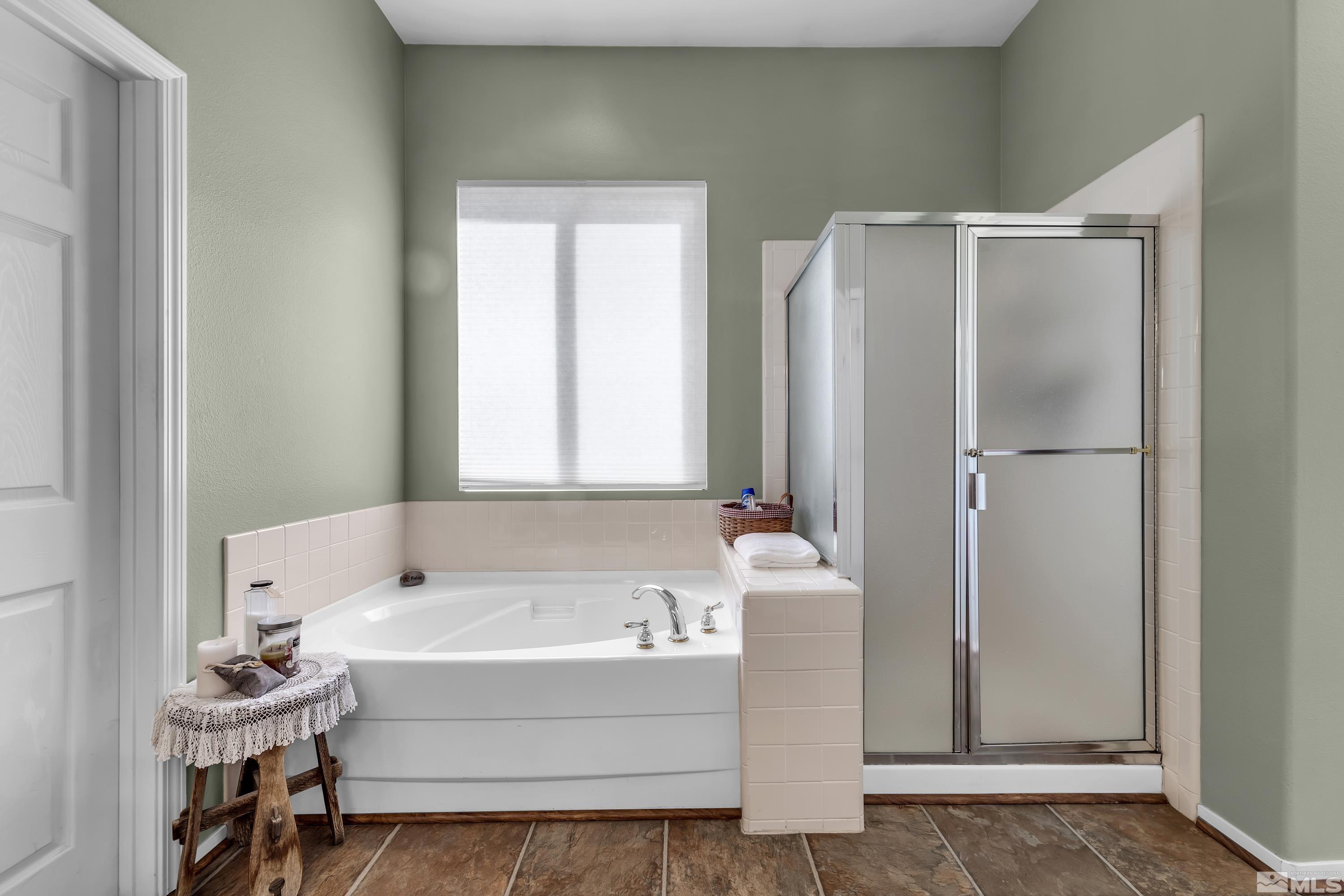 1496 Gaucho Lane Reno, NV 89521 - Photo 29 of 40 a bathroom with a bathtub and a sink