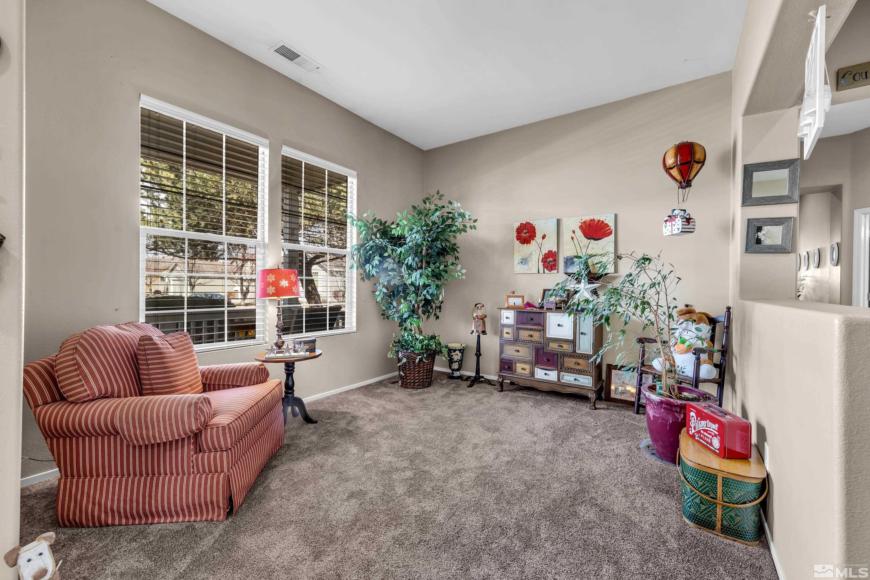 1496 Gaucho Lane Reno, NV 89521 - Photo 9 of 40 a living room with furniture and a window