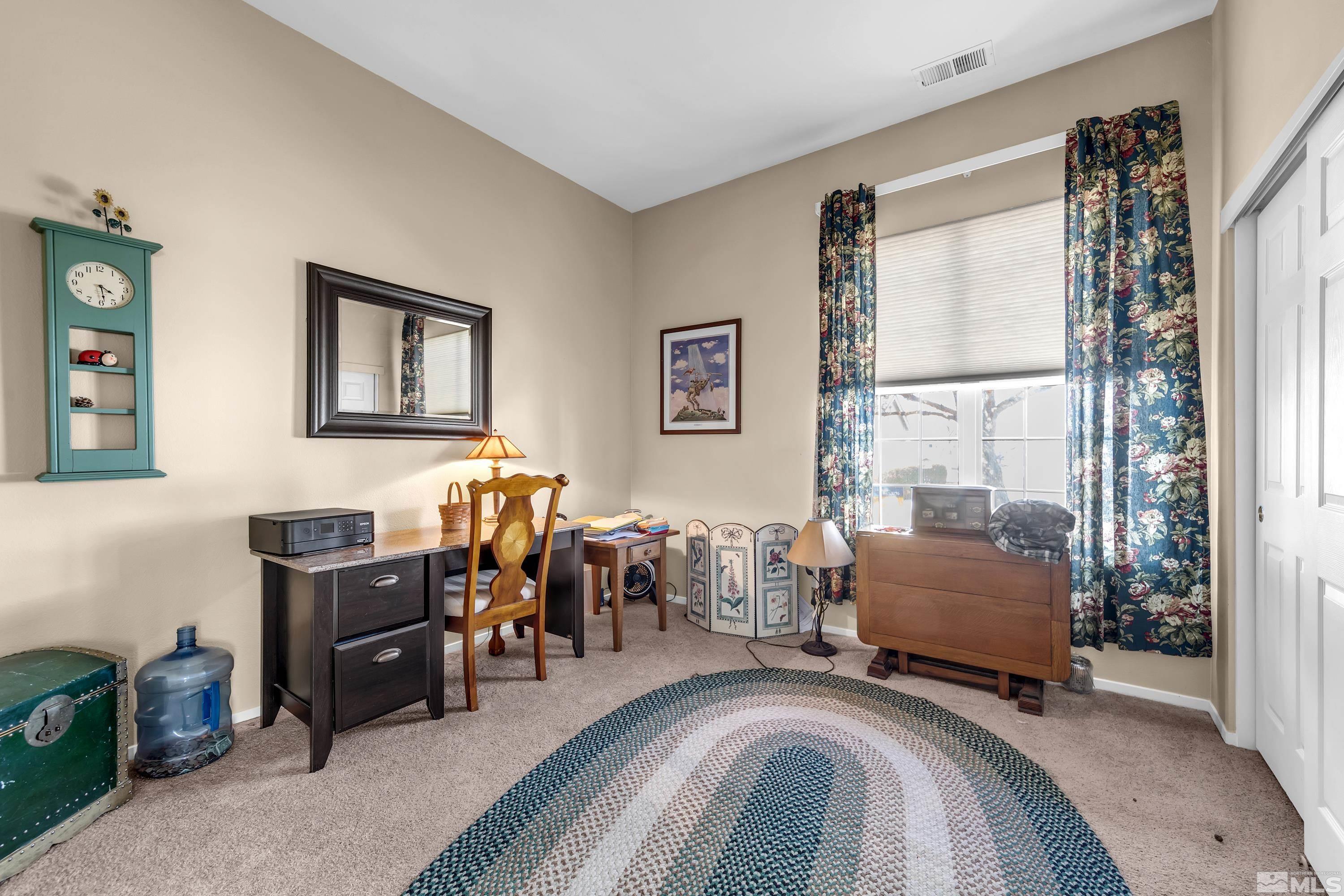 1496 Gaucho Lane Reno, NV 89521 - Photo 10 of 40 a bedroom with furniture and a window
