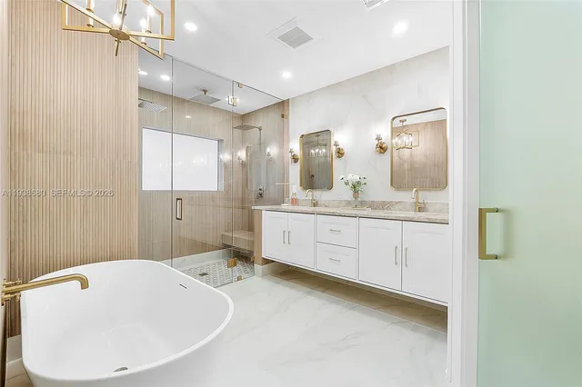 a bedroom with a large bed and a large window