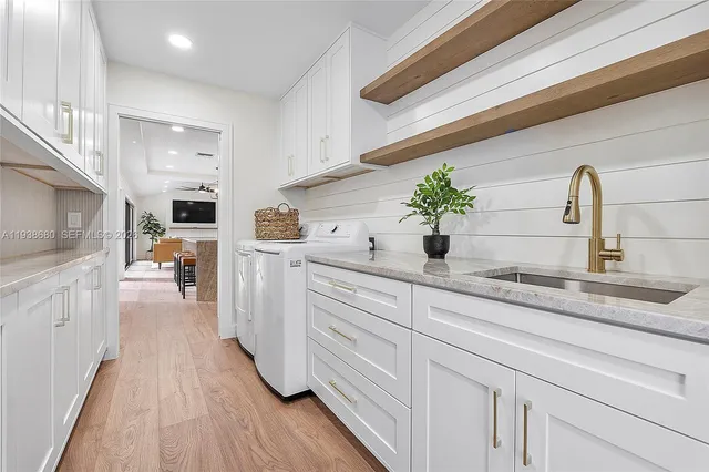 a living room with furniture fireplace and a large window