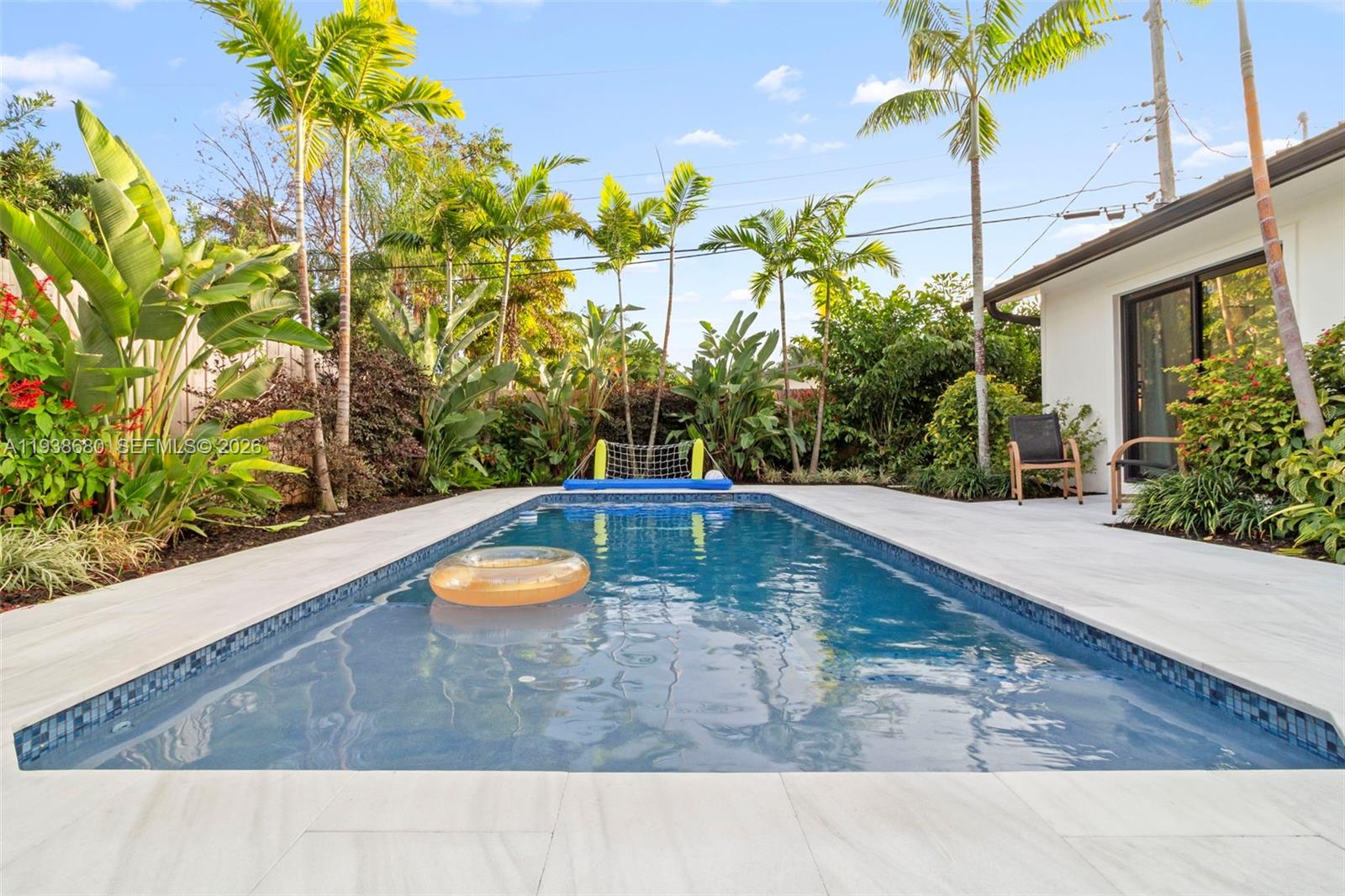 3540 Northeast 28th Avenue Lighthouse Point, FL 33064 - Photo 6 of 47 a view of a swimming pool with a patio