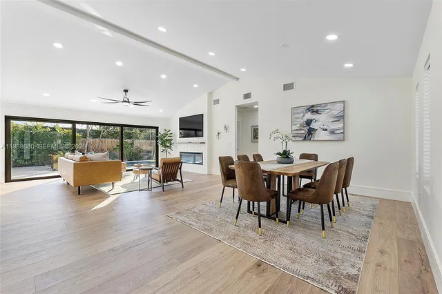 a living room with fireplace furniture and a flat screen tv