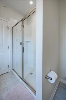 a bathroom with a shower and a toilet