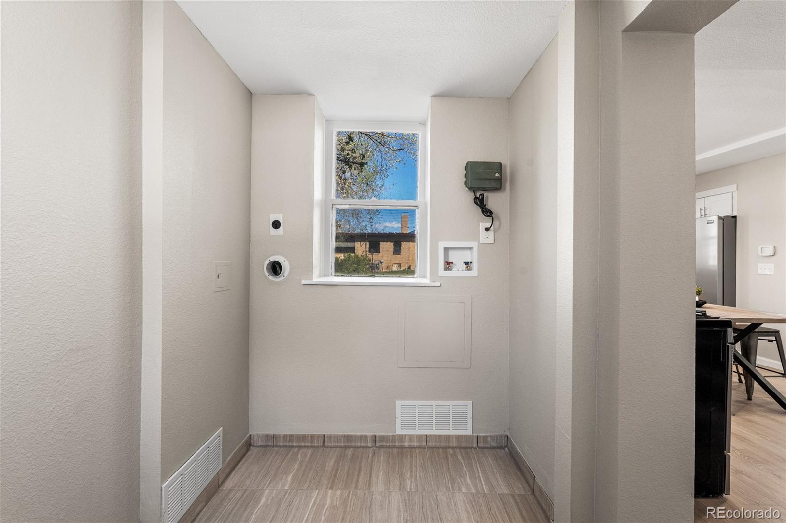2259 Depew Street Edgewater, CO 80214 - Photo 18 of 46 a view of a hallway with wooden floor and closet
