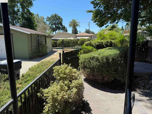 a view of a garden from a balcony