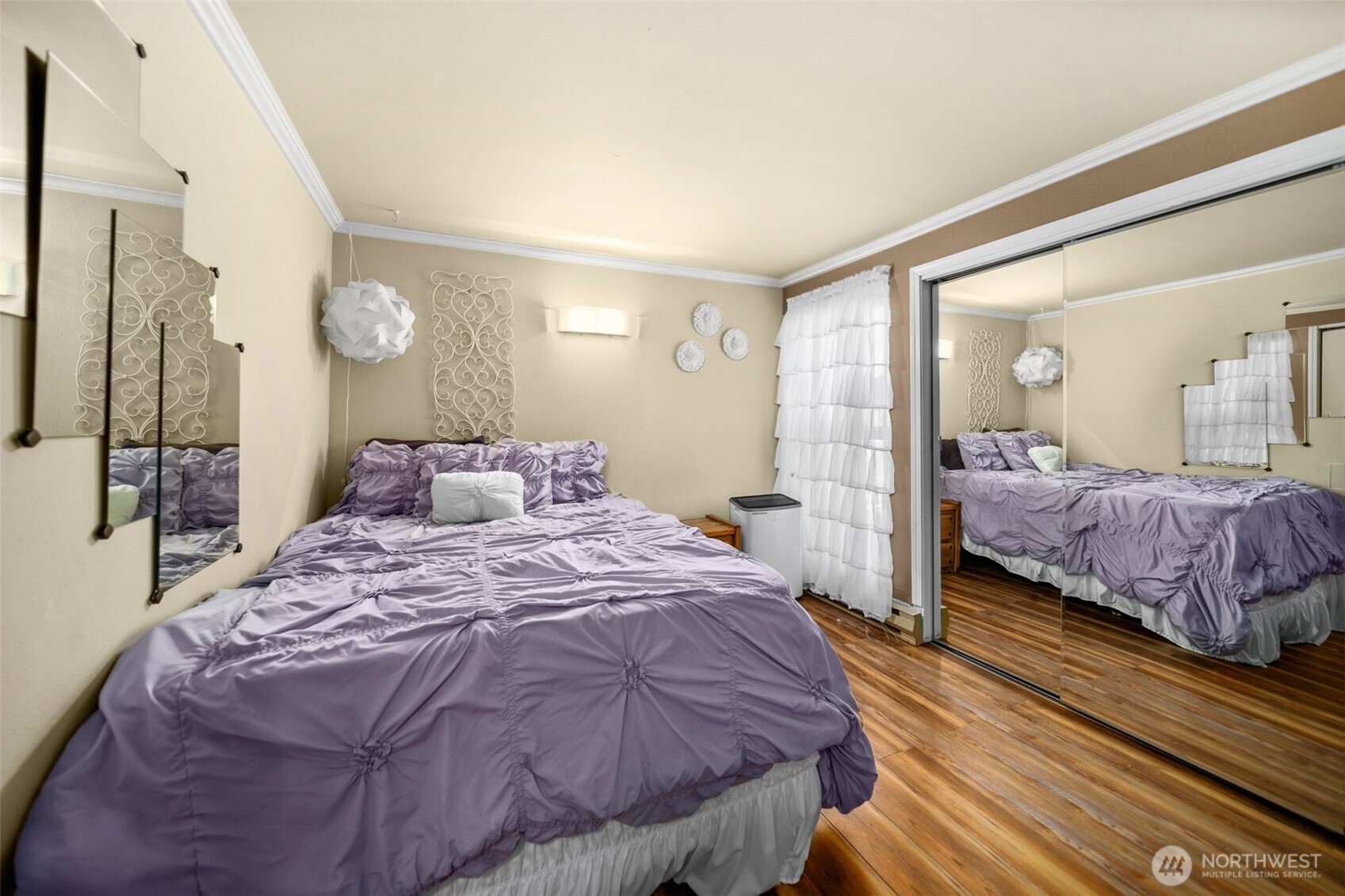 8903 Crescent Bar Road Northwest, Unit 101 Quincy, WA 98848 - Photo 18 of 40 a bedroom with bed and a large mirror