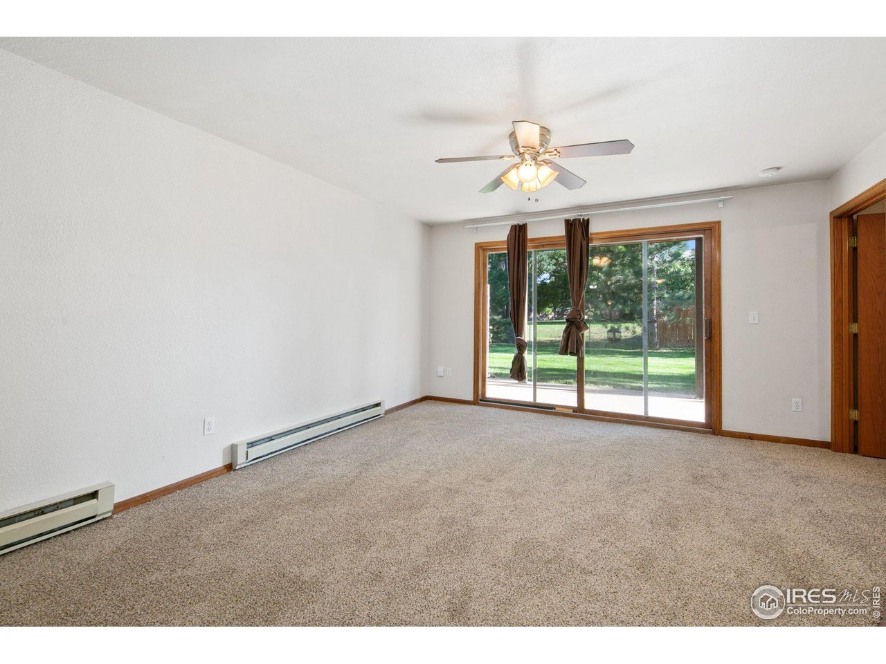 1231 West Swallow Road, Unit 316 Fort Collins, CO 80526 - Photo 11 of 42 a view of a livingroom with a ceiling fan and window