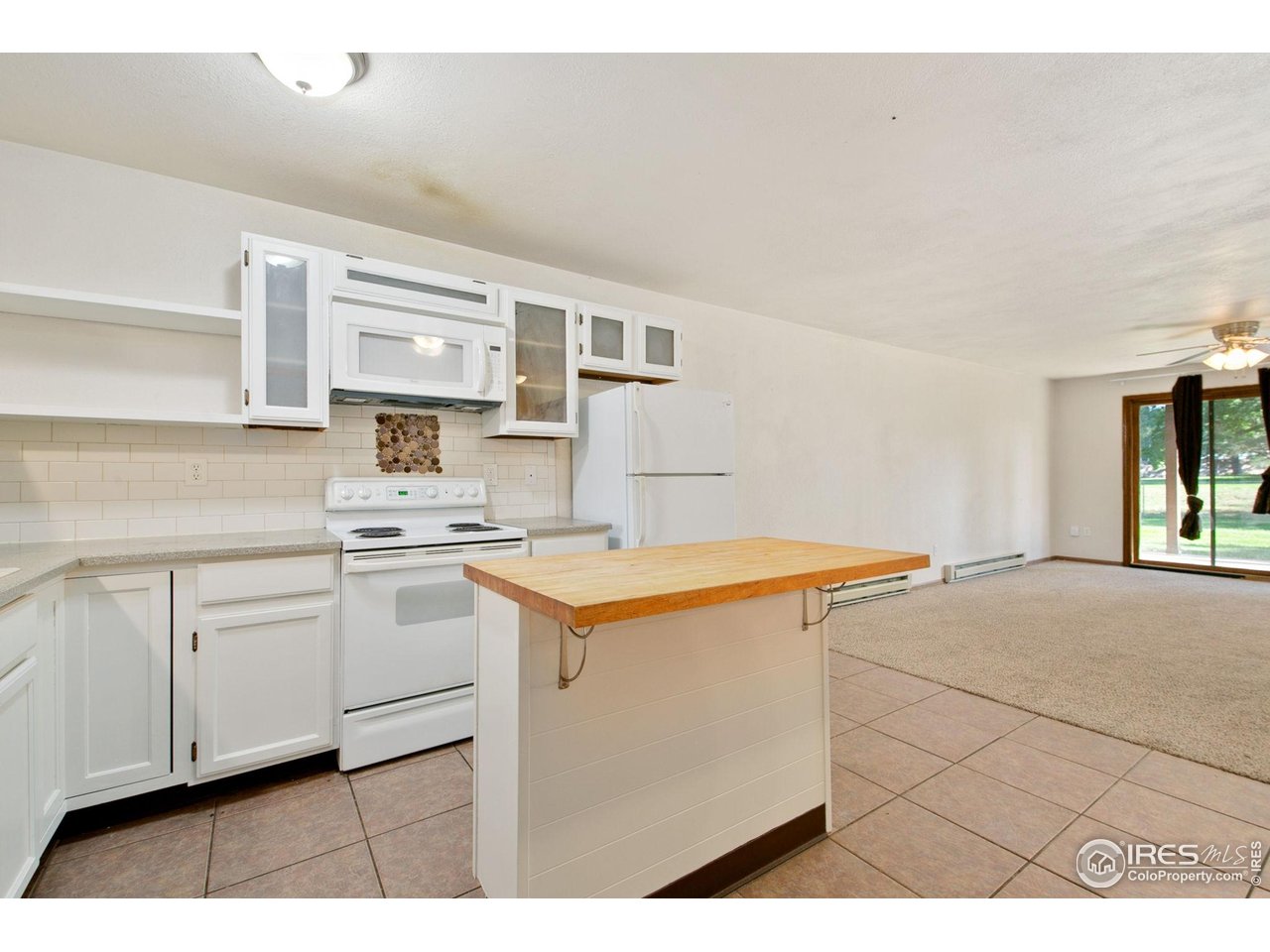 1231 West Swallow Road, Unit 316 Fort Collins, CO 80526 - Photo 17 of 42 a kitchen with stainless steel appliances granite countertop a sink stove and cabinets