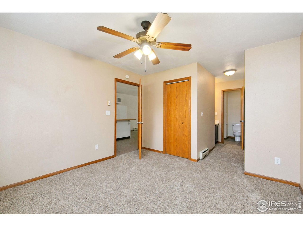 1231 West Swallow Road, Unit 316 Fort Collins, CO 80526 - Photo 24 of 42 a view of an empty room with a ceiling fan