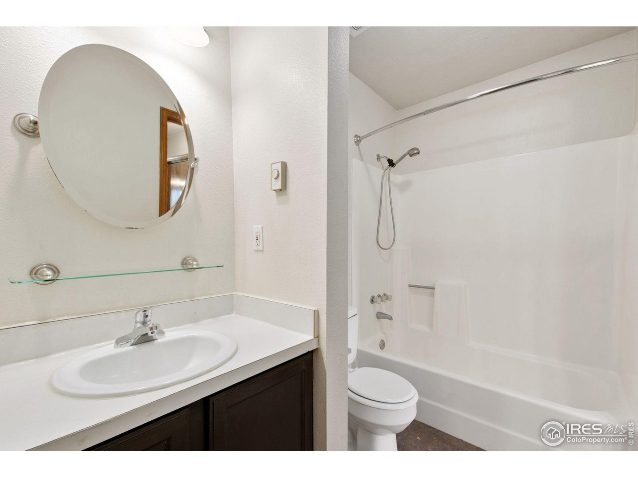 1231 West Swallow Road, Unit 316 Fort Collins, CO 80526 - Photo 26 of 42 a bathroom with a sink a toilet and shower