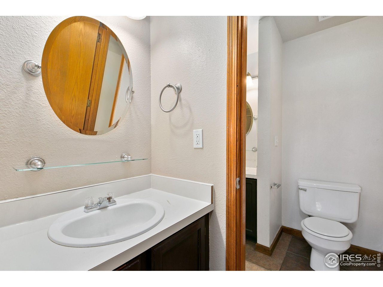 1231 West Swallow Road, Unit 316 Fort Collins, CO 80526 - Photo 27 of 42 a bathroom with a sink and a mirror