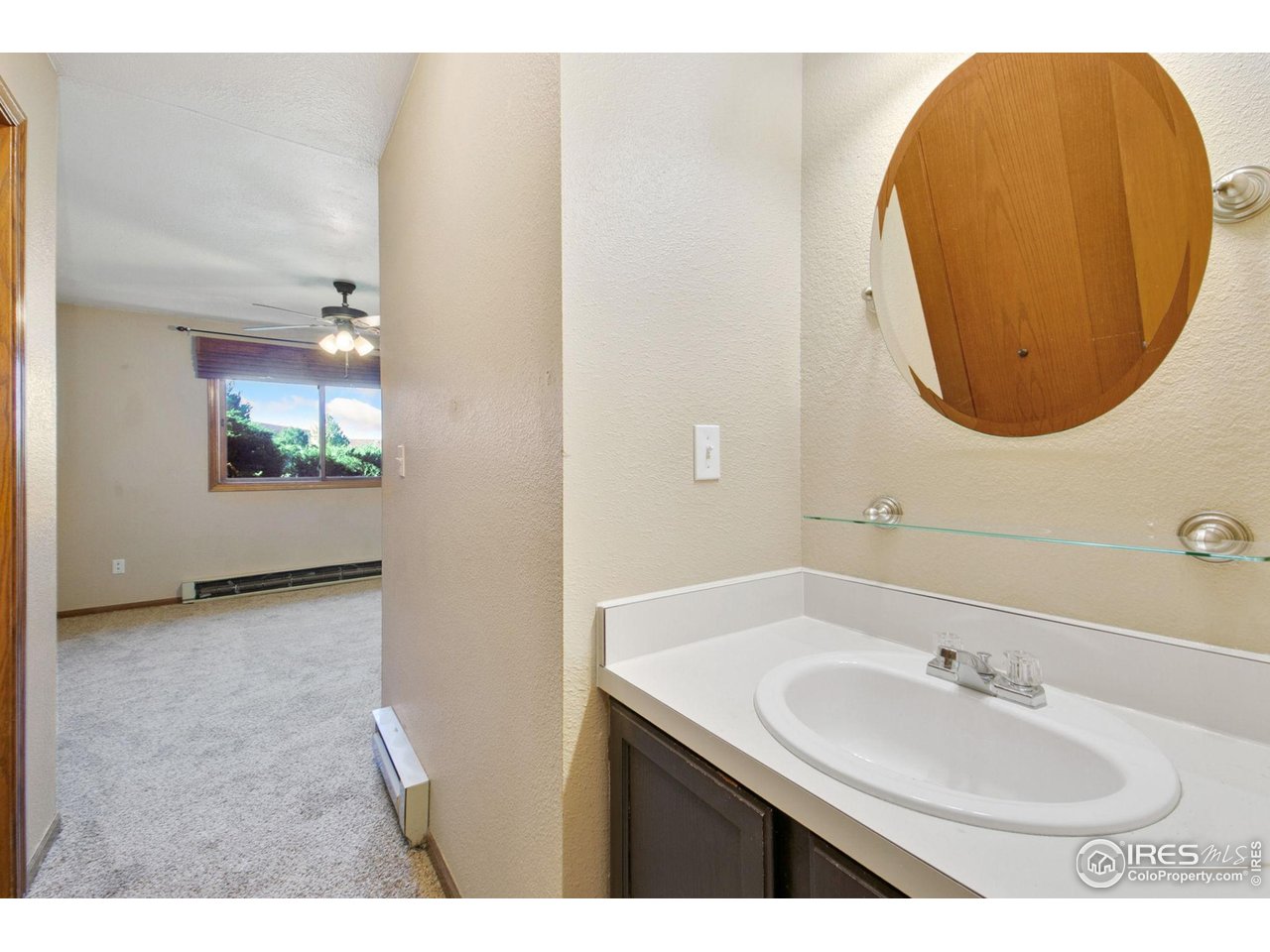 1231 West Swallow Road, Unit 316 Fort Collins, CO 80526 - Photo 28 of 42 a bathroom with a sink and a mirror