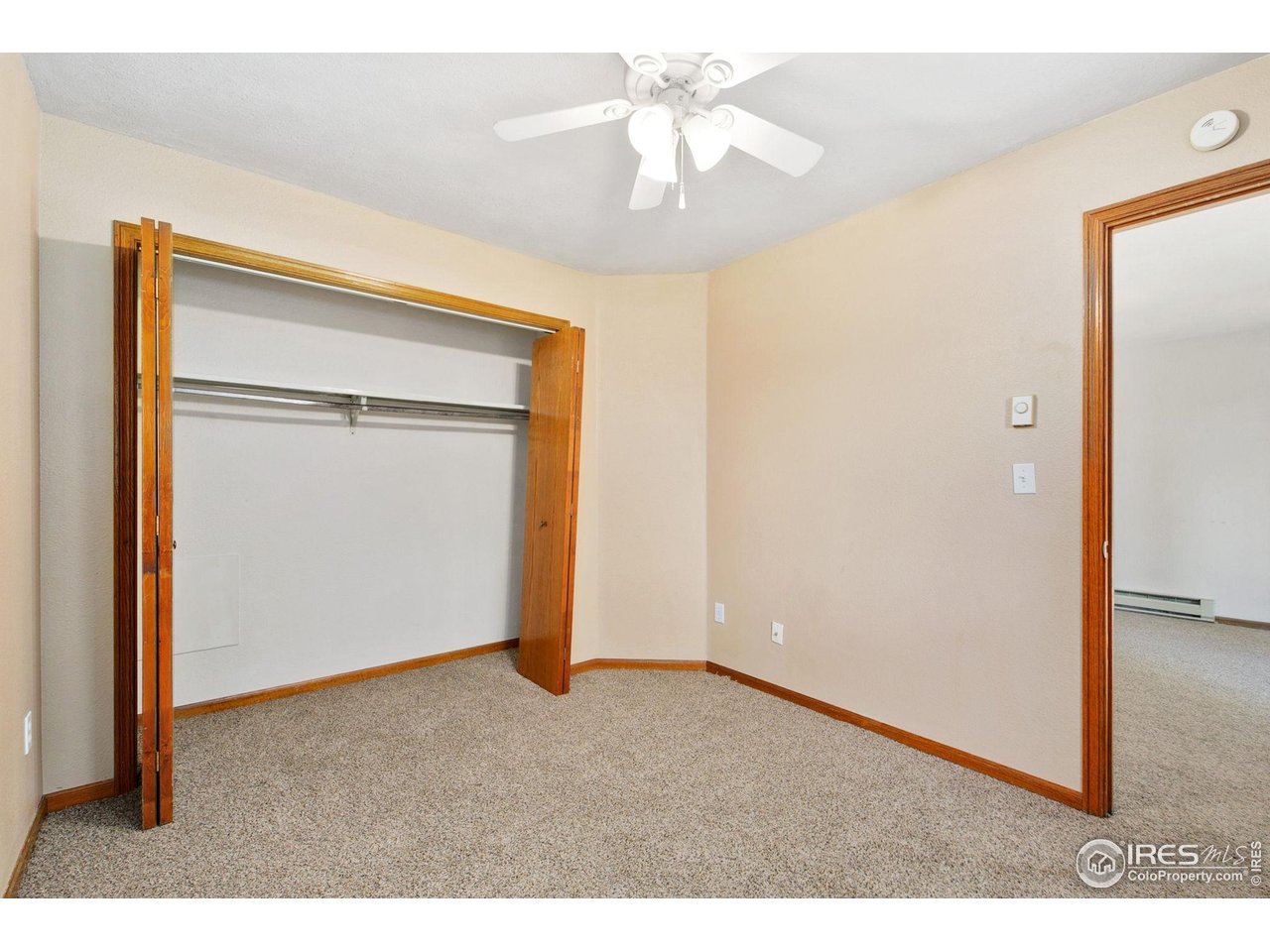 1231 West Swallow Road, Unit 316 Fort Collins, CO 80526 - Photo 30 of 42 a view of an empty room and a ceiling fan