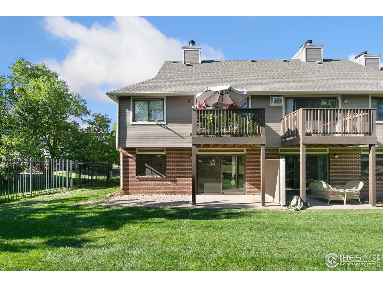 1231 West Swallow Road, Unit 316 Fort Collins, CO 80526 - Photo 3 of 42 a front view of a house with a yard
