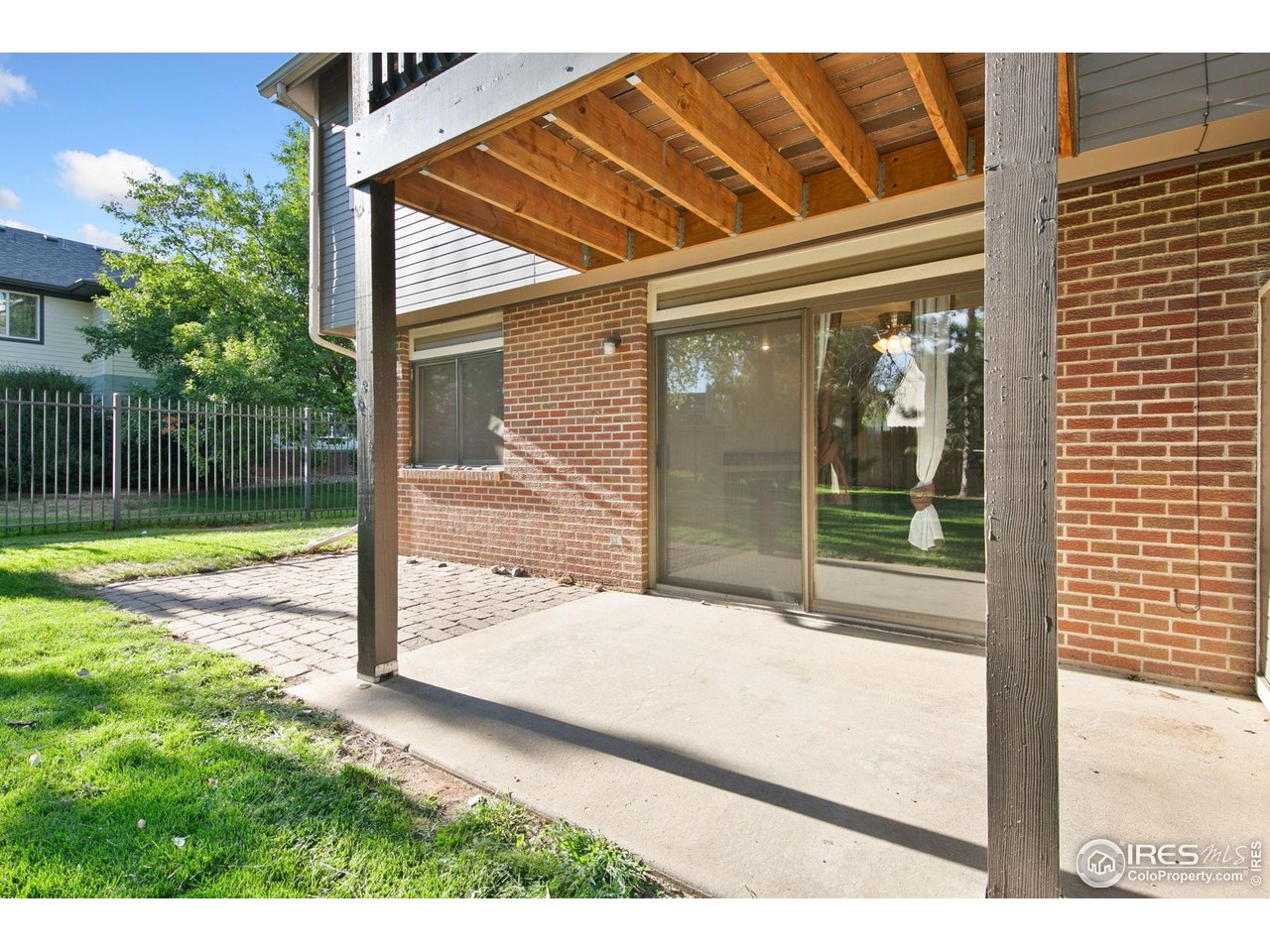 1231 West Swallow Road, Unit 316 Fort Collins, CO 80526 - Photo 34 of 42 a backyard of a house with table and chairs