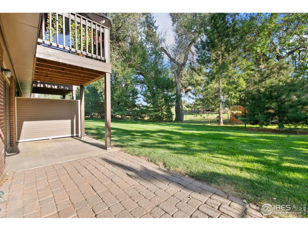 1231 West Swallow Road, Unit 316 Fort Collins, CO 80526 - Photo 35 of 42 a view of a house with a yard