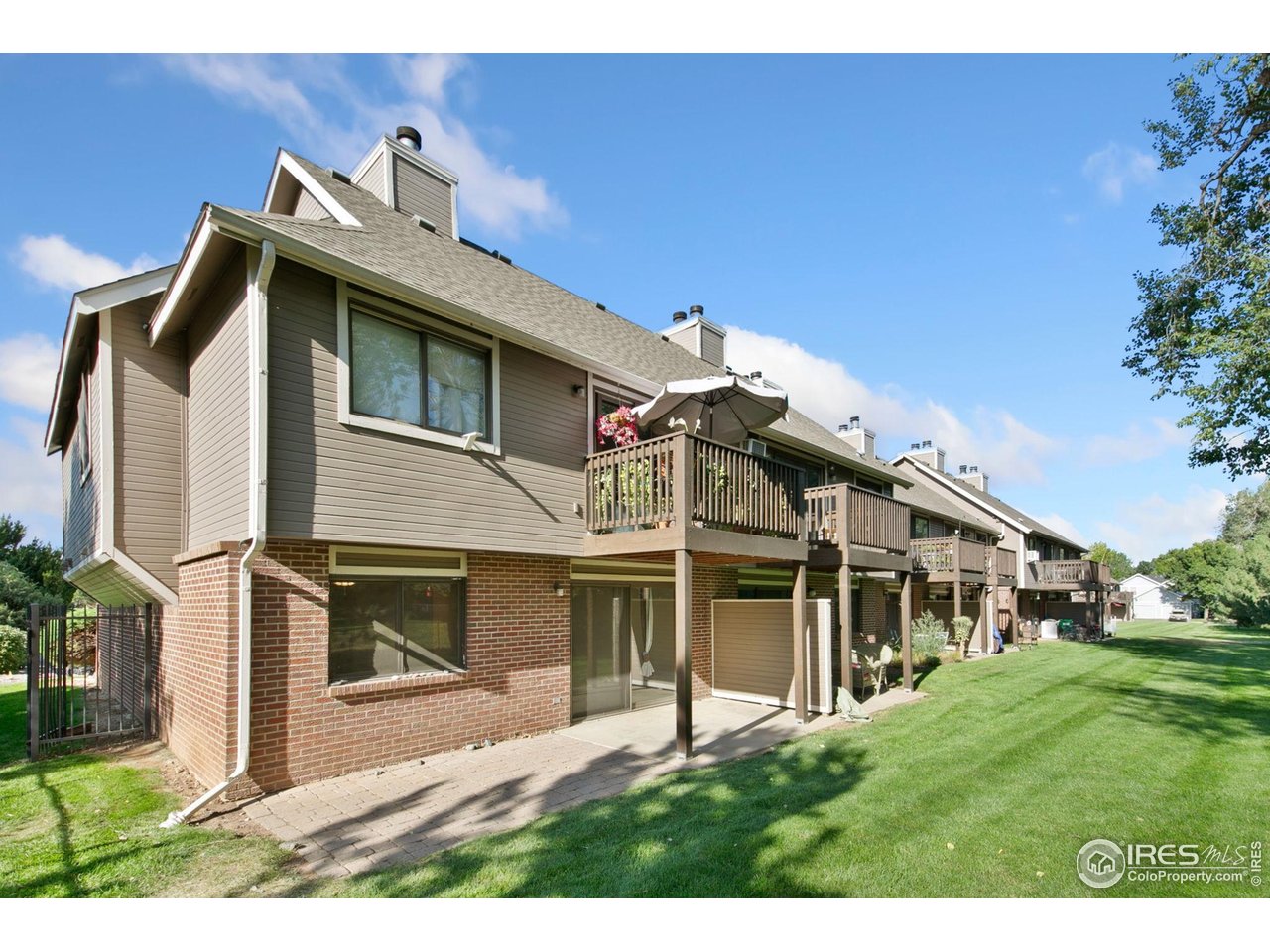 1231 West Swallow Road, Unit 316 Fort Collins, CO 80526 - Photo 36 of 42 a view of front of house with a yard