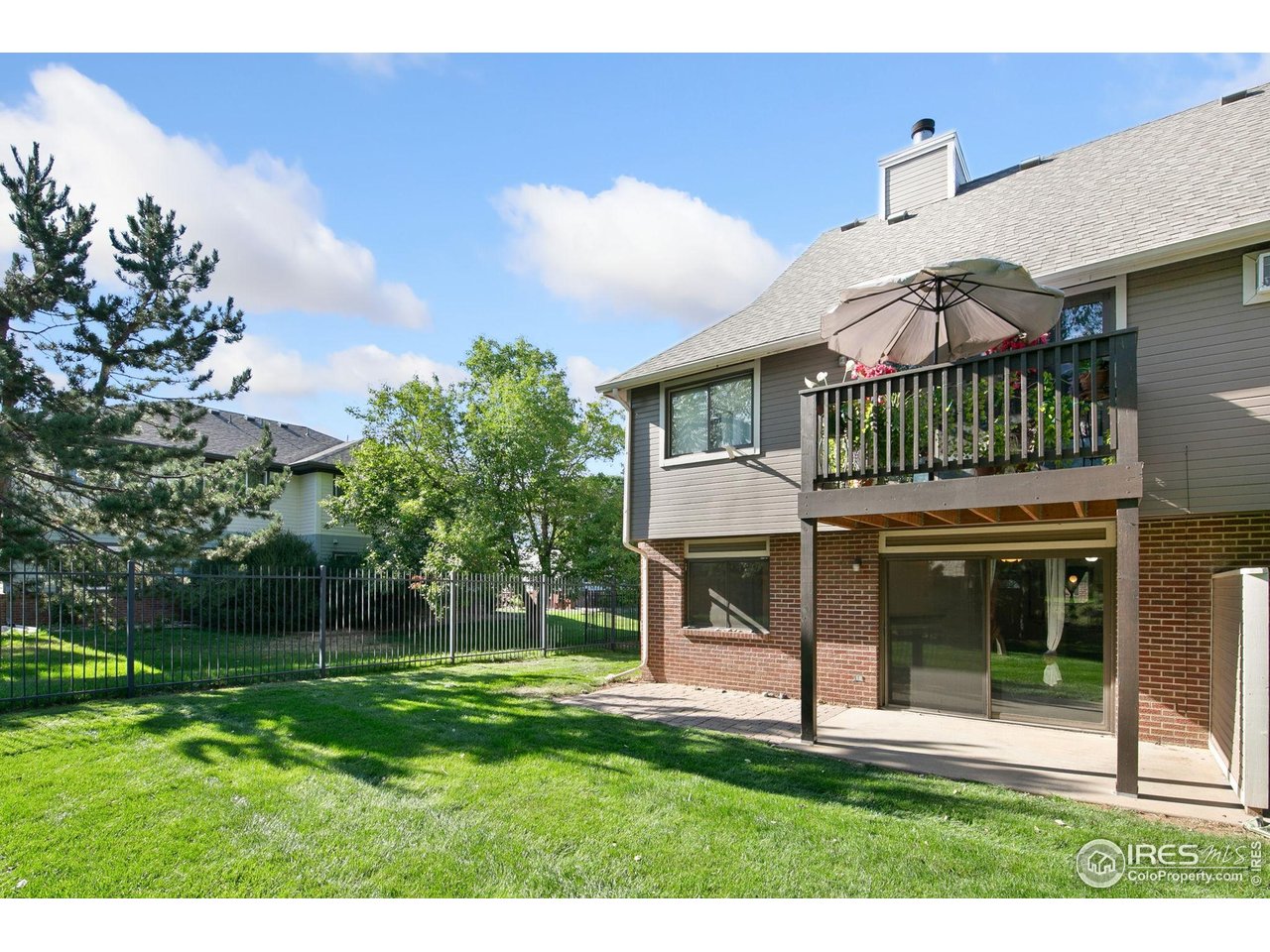 1231 West Swallow Road, Unit 316 Fort Collins, CO 80526 - Photo 37 of 42 a view of a front door and a yard