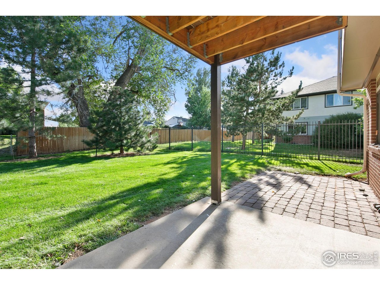 1231 West Swallow Road, Unit 316 Fort Collins, CO 80526 - Photo 39 of 42 a view of a backyard with a garden and plants