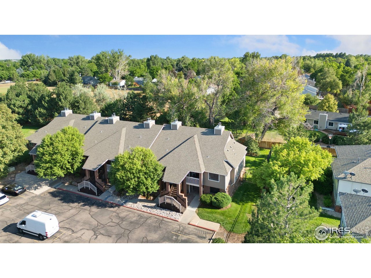 1231 West Swallow Road, Unit 316 Fort Collins, CO 80526 - Photo 40 of 42 a backyard of a house with a yard and outdoor seating
