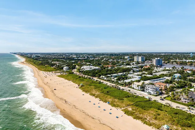 an aerial view of residential building and ocean