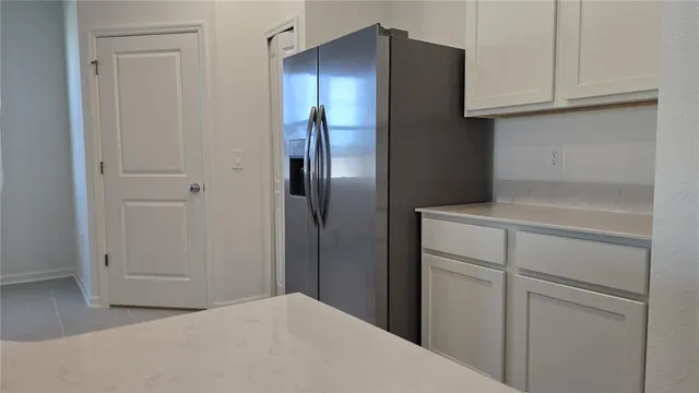 a kitchen with cabinets and stainless steel appliances