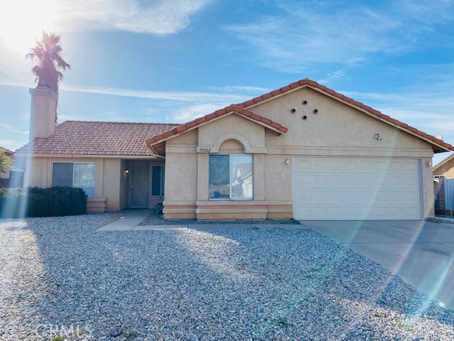 13022 Snowview Road Victorville, CA 92392 - Photo 1 of 1 a view of a house with a yard