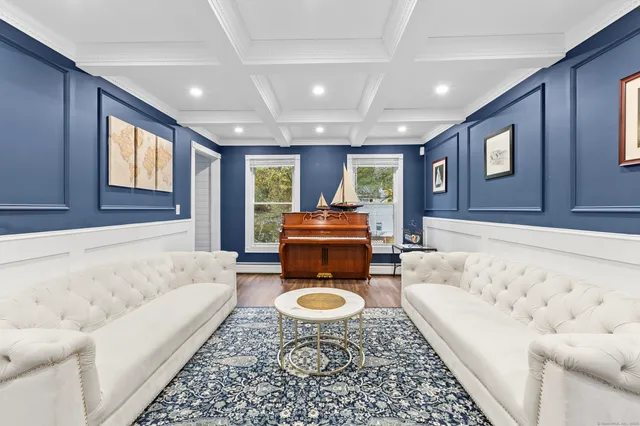 a living room with furniture and a rug