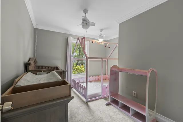 a bedroom with furniture and a window