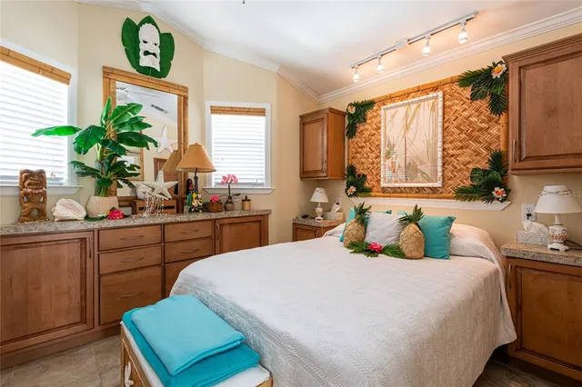 a bedroom with a large bed and a window