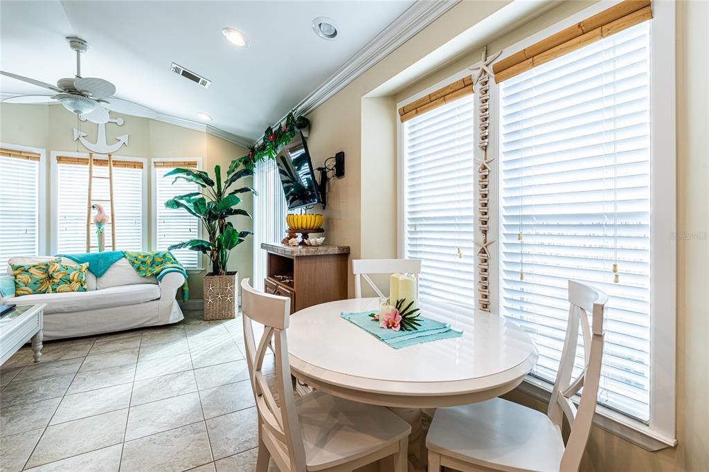 20300 Leonard Road, Unit 33 Lutz, FL 33558 - Photo 17 of 36 a view of a dining room with furniture and window