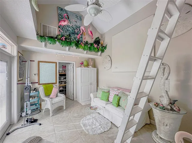 a living room with furniture and flat screen tv
